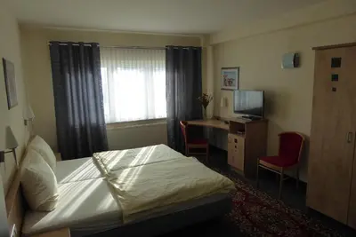 Ein Bett oder Betten in einem Zimmer der Unterkunft Hotel Ring Park