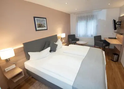 Ein Bett oder Betten in einem Zimmer der Unterkunft Neckarperle