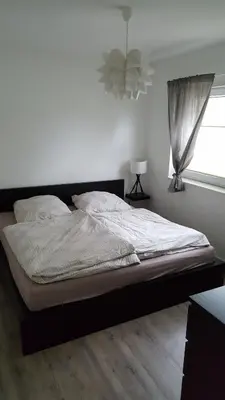 Ein Bett oder Betten in einem Zimmer der Unterkunft Ferienwohnung am Modenbach