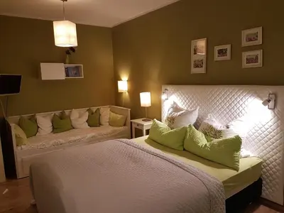 Ein Bett oder Betten in einem Zimmer der Unterkunft Ferienwohnung Grewe