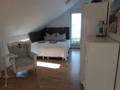 Ein Bett oder Betten in einem Zimmer der Unterkunft Ferienwohnung Grewe