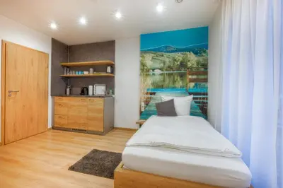 Ein Bett oder Betten in einem Zimmer der Unterkunft Pension Breitenauer See