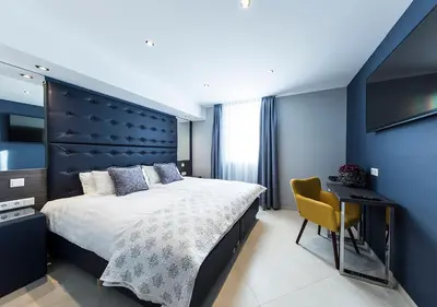 Ein Bett oder Betten in einem Zimmer der Unterkunft Hotel Tommasi