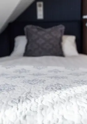 Ein Bett oder Betten in einem Zimmer der Unterkunft Hotel Tommasi