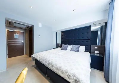 Ein Bett oder Betten in einem Zimmer der Unterkunft Hotel Tommasi