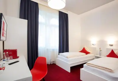 Ein Bett oder Betten in einem Zimmer der Unterkunft Hotel Mille Stelle City