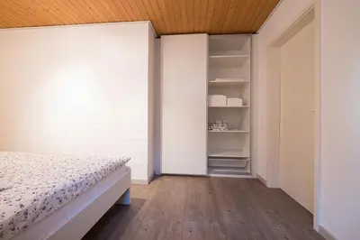 Ein Bett oder Betten in einem Zimmer der Unterkunft Ina's Ferienwohnung