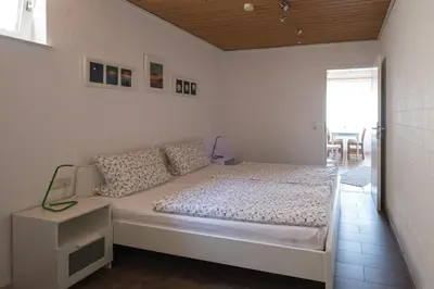 Ein Bett oder Betten in einem Zimmer der Unterkunft Ina's Ferienwohnung