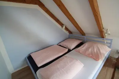 Ein Bett oder Betten in einem Zimmer der Unterkunft Ferienwohnung Karlsruhe