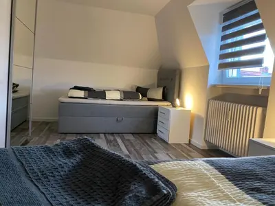 Ein Bett oder Betten in einem Zimmer der Unterkunft Ermmes Ferienwohnungen