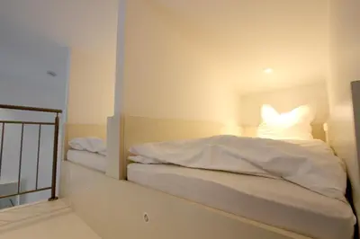 Ein Bett oder Betten in einem Zimmer der Unterkunft Neumann's Übernachtung