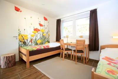 Ein Bett oder Betten in einem Zimmer der Unterkunft Hainhof Gästewohnungen