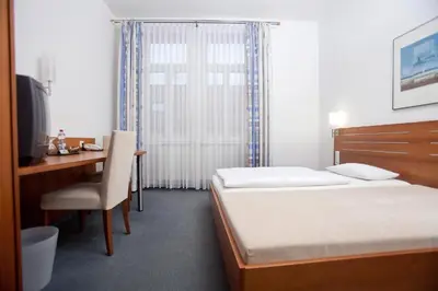 Ein Bett oder Betten in einem Zimmer der Unterkunft Hotel Grünshof