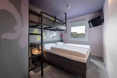 Ein Bett oder Betten in einem Zimmer der Unterkunft Felix Hotel Darmstadt