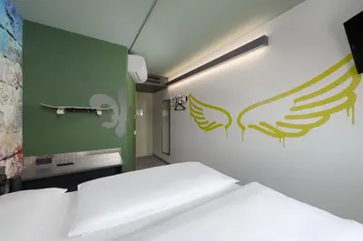 Ein Bett oder Betten in einem Zimmer der Unterkunft Felix Hotel Darmstadt