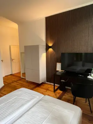 Ein Bett oder Betten in einem Zimmer der Unterkunft Hotel Hahn Gondelsheim