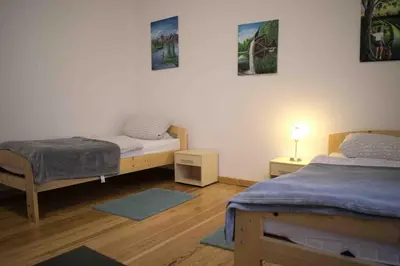 Ein Bett oder Betten in einem Zimmer der Unterkunft Goldstadt Ferienwohnung