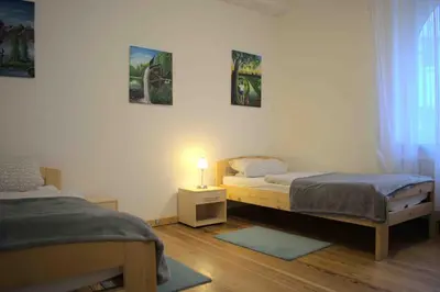 Ein Bett oder Betten in einem Zimmer der Unterkunft Goldstadt Ferienwohnung