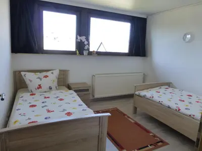 Ein Bett oder Betten in einem Zimmer der Unterkunft Ferienwohnung Irmgard und Ferienwohnung Gerlinde