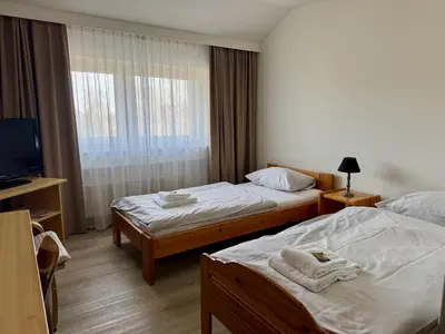 Ein Bett oder Betten in einem Zimmer der Unterkunft Gästehaus Haßloch/Pfalz