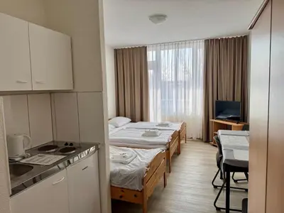 Ein Bett oder Betten in einem Zimmer der Unterkunft Gästehaus Haßloch/Pfalz