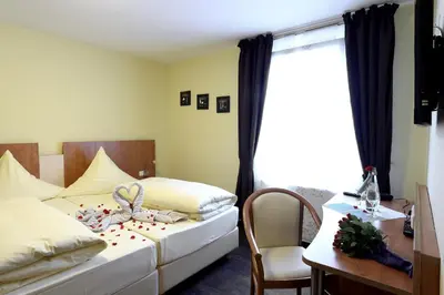 Ein Bett oder Betten in einem Zimmer der Unterkunft Hotel Europa - Restaurant