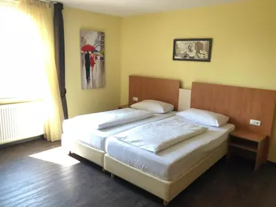 Ein Bett oder Betten in einem Zimmer der Unterkunft Hotel Europa - Restaurant