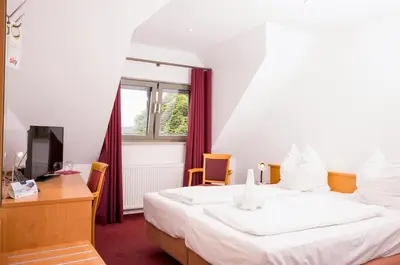 Ein Bett oder Betten in einem Zimmer der Unterkunft Hotel Restaurant Zehntscheune