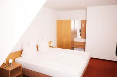 Ein Bett oder Betten in einem Zimmer der Unterkunft Hotel Restaurant Zehntscheune