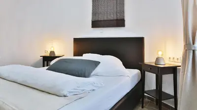Ein Bett oder Betten in einem Zimmer der Unterkunft Hotel Frankenthaler Hof