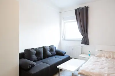 Ein Bett oder Betten in einem Zimmer der Unterkunft Holidayapartment Rüsselsheim