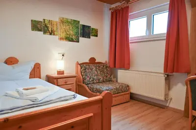 Ein Bett oder Betten in einem Zimmer der Unterkunft Grüner Baum