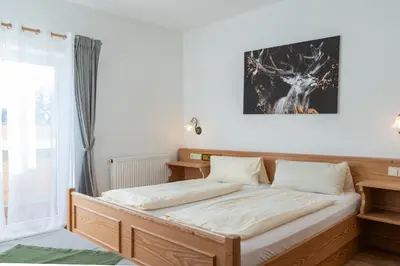 Ein Bett oder Betten in einem Zimmer der Unterkunft Grüner Baum