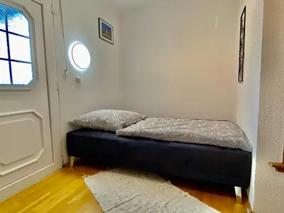 Ein Bett oder Betten in einem Zimmer der Unterkunft Ferienwohnung Südpfalzblick