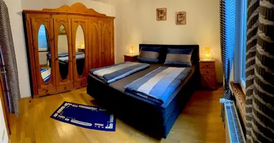Ein Bett oder Betten in einem Zimmer der Unterkunft Ferienwohnung Südpfalzblick