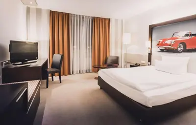 Ein Bett oder Betten in einem Zimmer der Unterkunft elaya hotel stuttgart ludwigsburg, Trademark by Wyndham