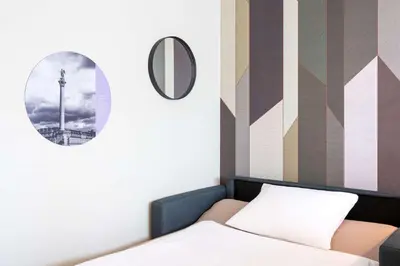Ein Bett oder Betten in einem Zimmer der Unterkunft elaya hotel stuttgart ludwigsburg, Trademark by Wyndham