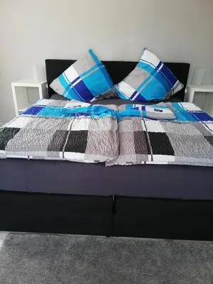 Ein Bett oder Betten in einem Zimmer der Unterkunft Gasthof Schillereck