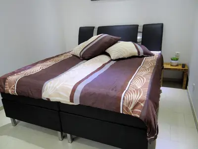 Ein Bett oder Betten in einem Zimmer der Unterkunft Travelers Home
