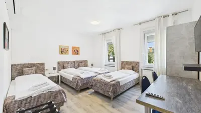 Ein Bett oder Betten in einem Zimmer der Unterkunft City Hotel