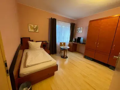 Ein Bett oder Betten in einem Zimmer der Unterkunft Heppenheimer Hof Hotel