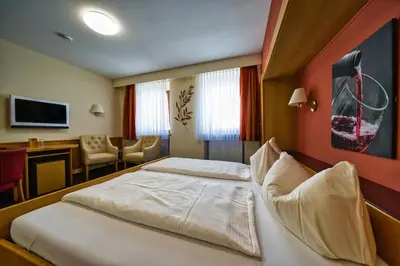 Ein Bett oder Betten in einem Zimmer der Unterkunft Hotel Tenner
