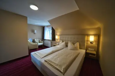 Ein Bett oder Betten in einem Zimmer der Unterkunft Hotel Tenner