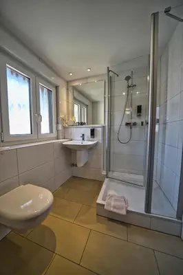 Ein Badezimmer in der Unterkunft Hotel Tenner