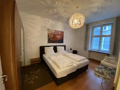 Ein Bett oder Betten in einem Zimmer der Unterkunft 2 Zimmer Appartement am Bismarckplatz Heidelberg
