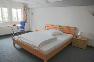Ein Bett oder Betten in einem Zimmer der Unterkunft Hotel Haus Landgraf