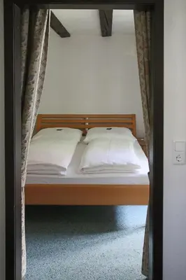 Ein Bett oder Betten in einem Zimmer der Unterkunft Doernersches Haus
