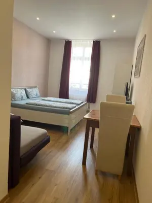 Ein Bett oder Betten in einem Zimmer der Unterkunft Trang Hotel Rastatt