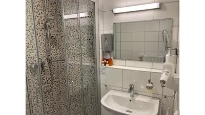 Ein Badezimmer in der Unterkunft Hotel Adler mit Gasthaus