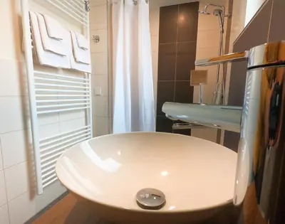 Ein Badezimmer in der Unterkunft Hotel Langhans